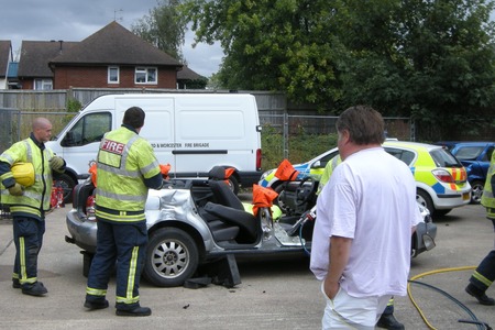 Car with roof removed by fire service